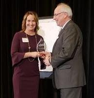 Julie Blitchok accepting Torch Award